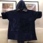 Pourquoi choisir un pull plaid pour vos soirées cocooning