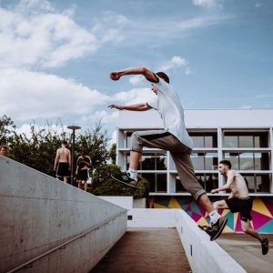 people doing yoga on gray concrete floor during daytime